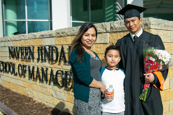 Jindal School executive graduate with family